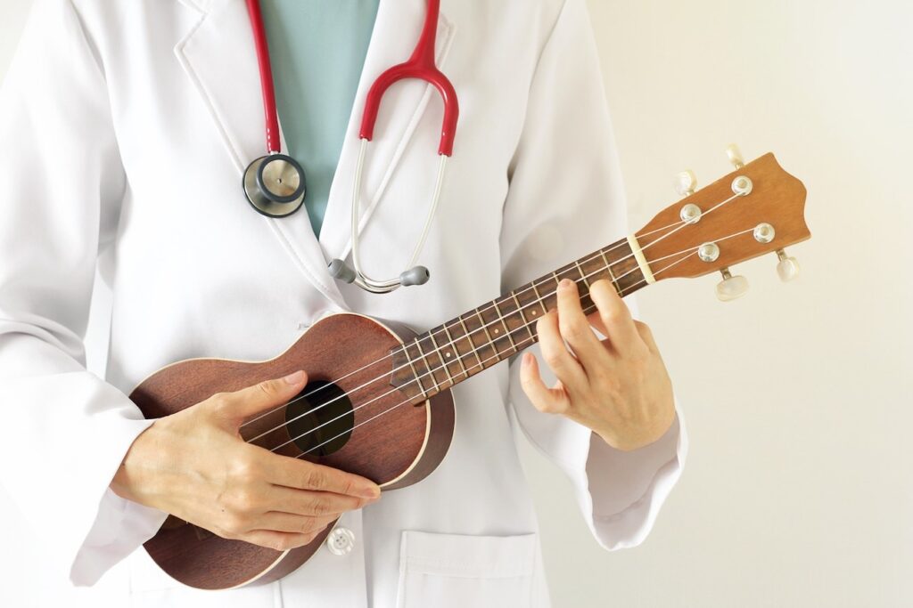 Doctor Playing Ukulele for Music Therapy